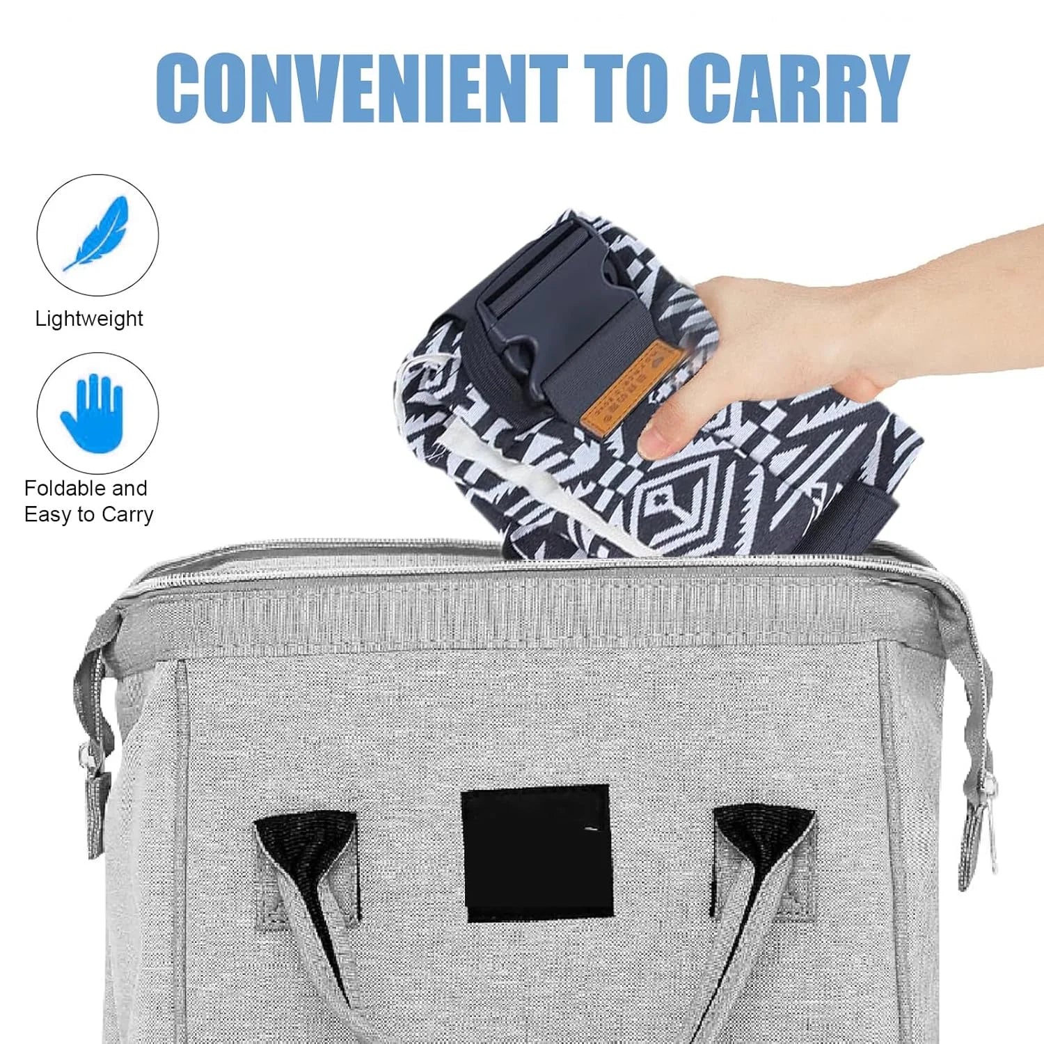 Folded patterned adjustable baby carrier wrap being placed into gray carrying bag.