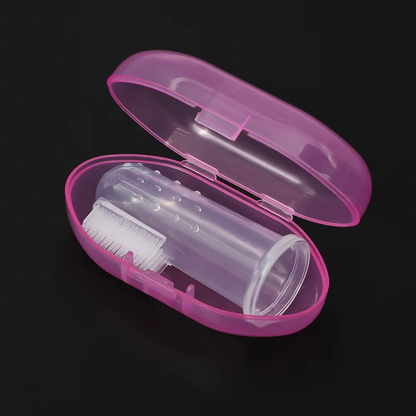 Transparent silicone finger toothbrush in open pink travel case on black background.