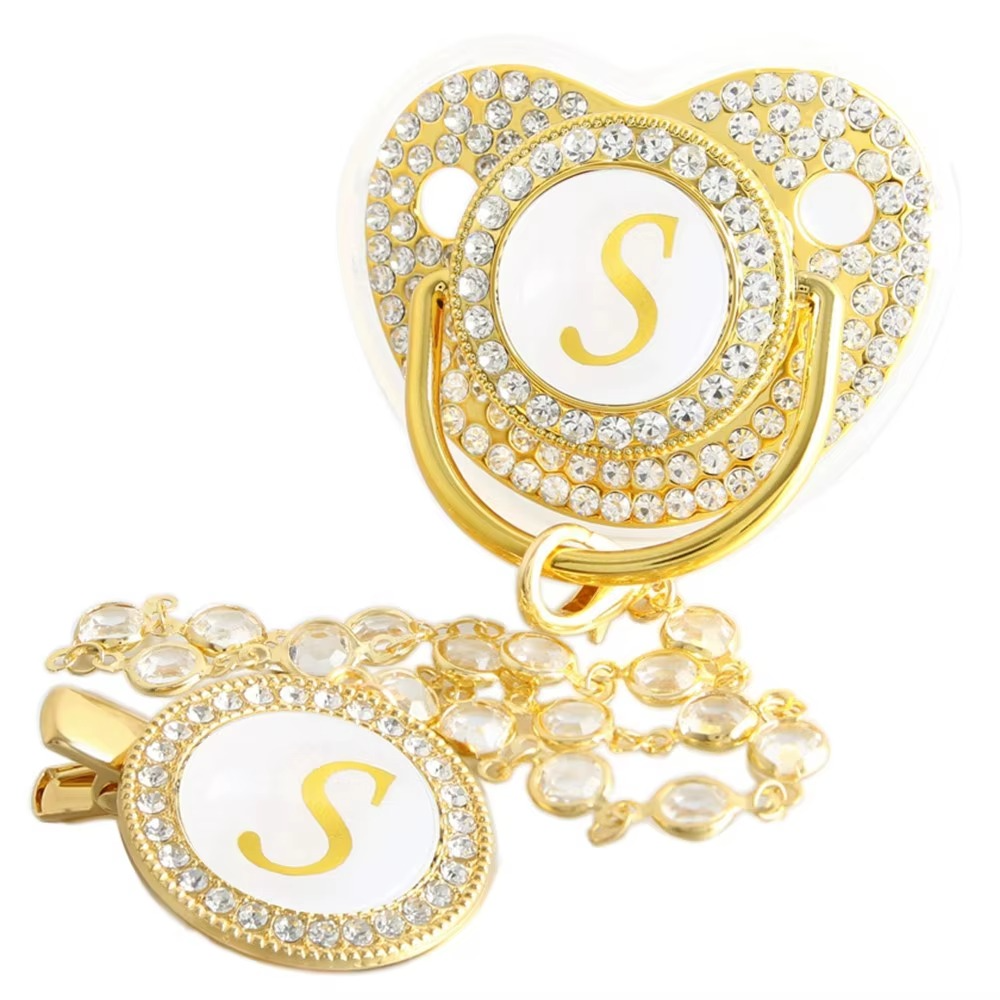 Personalized gold baby pacifier and crystal clip chain with letter S initial.