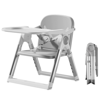 Gray folding portable baby booster seat with tray, shown unfolded and folded compactly.
