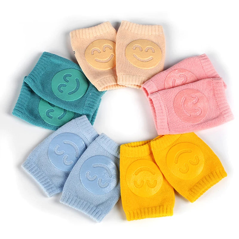 Circle of Comfort Crawl baby knee pads in five colors with smiley grip pads.