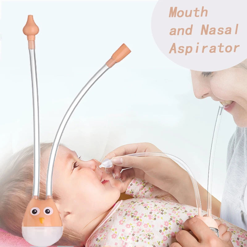 Orange owl baby nasal aspirator in use by parent on infant for gentle nasal suction.