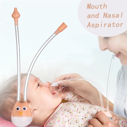 Orange owl baby nasal aspirator in use by parent on infant for gentle nasal suction.