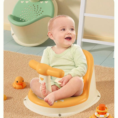 Yellow Comfy Baby Bath Seat with infant seated and bath toys on carpeted floor.