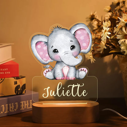 Gray elephant personalized baby night light with pink ears and name Juliette on wooden base.