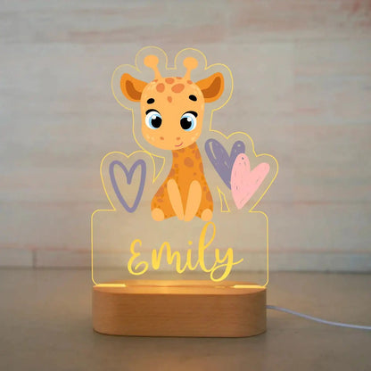 Personalized baby night light with cartoon giraffe and hearts, custom name Emily, on wooden base.